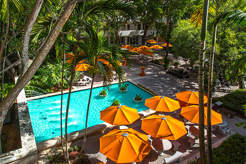 University of Miami Law School courtyard with umbrellas and fountain